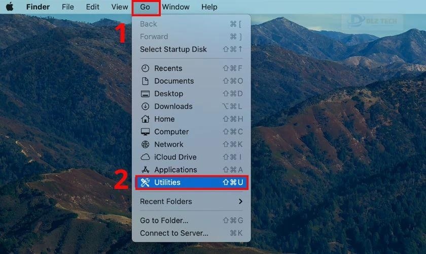 Mở Disk Utility bằng cách vào Go rồi chọn Utilities